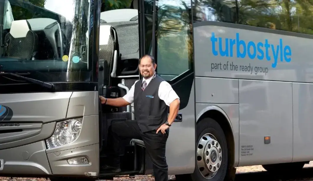 Driver stepping onto Turbostyle coach