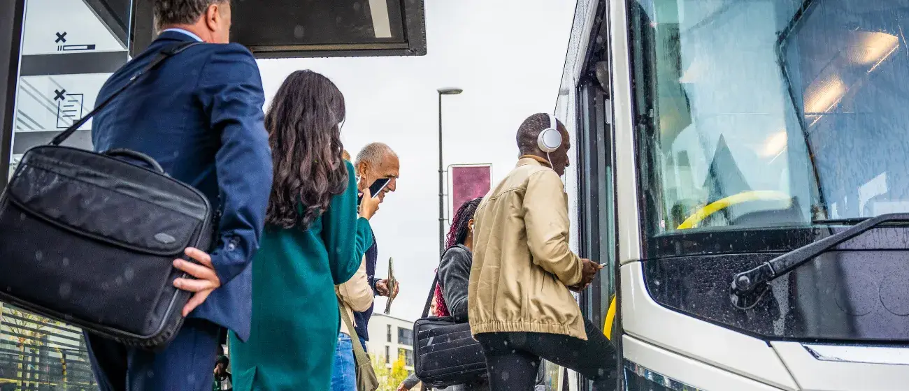 Professionals getting on a bus