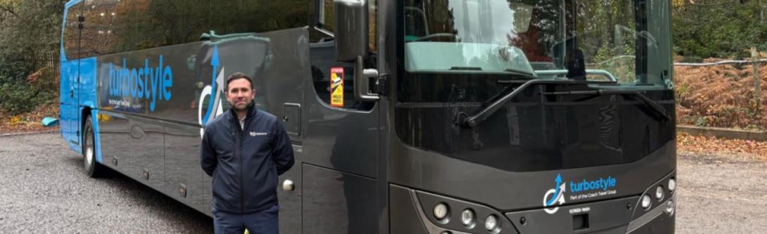 Driver stood next to Turbostyle coach